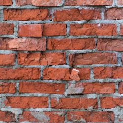 Old weathered rough textured brickwork